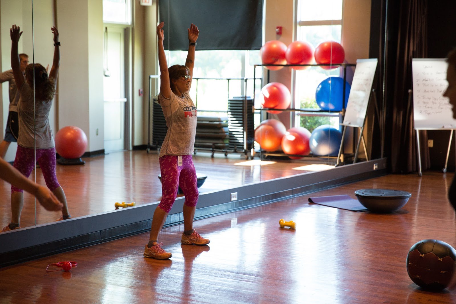 Workout instructor calling out move at the Greenville Kroc Center